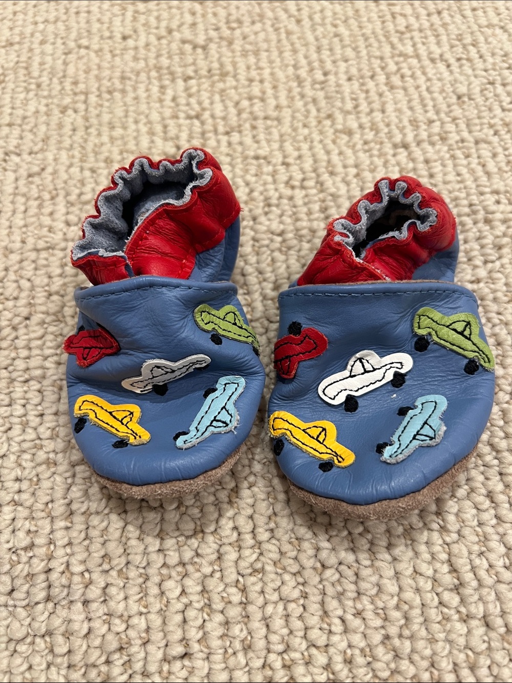EUC Robeez Blue Leather Baby Slip-Ons with Red Trim and Multicolor Car Patches